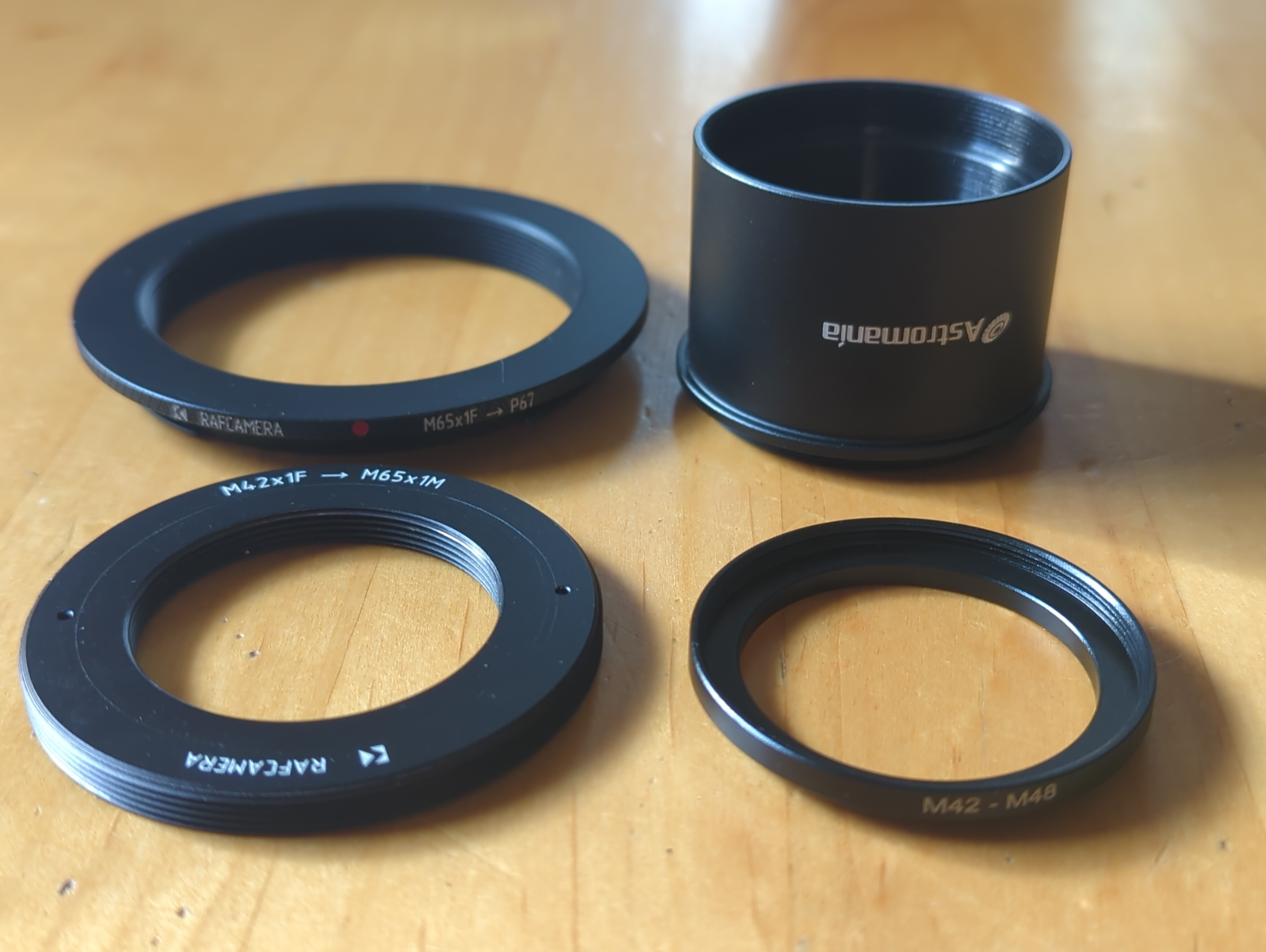 Four adapters for connecting a Pentax 6x7 to a 2 inch telescope